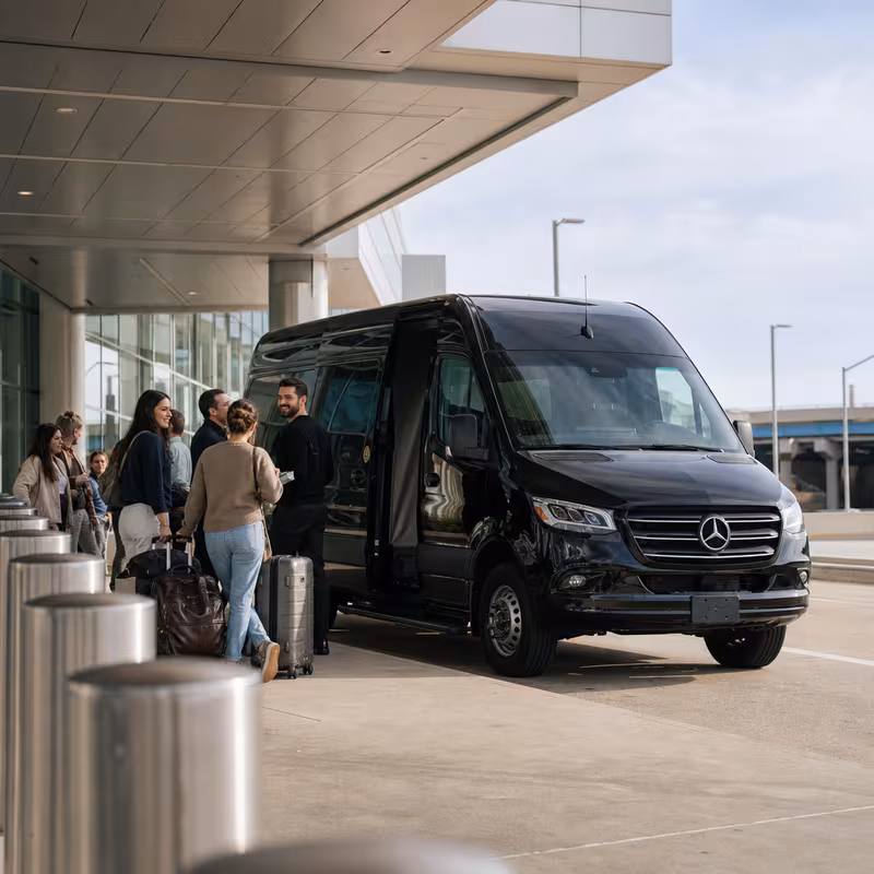 Group boarding a white charter bus for Airport Transportation transportation in Charlotte