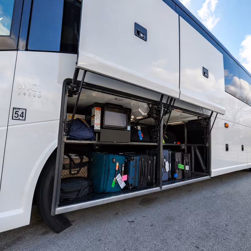Party bus interior with wraparound leather seating and LED lighting in Charlotte