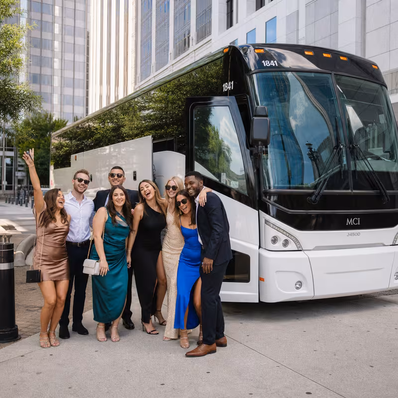 Passengers loading luggage while boarding an Charlotte group shuttle