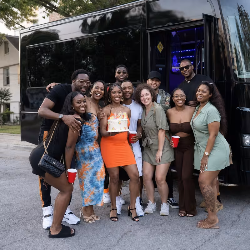 Group boarding a white charter bus for Birthday Transportation transportation in Charlotte