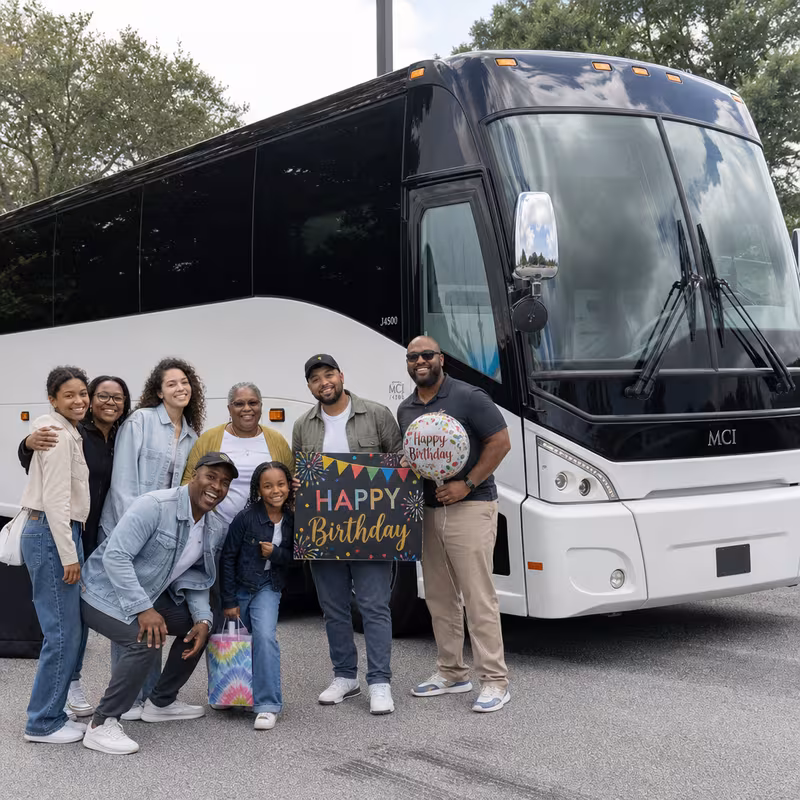 Passengers loading luggage while boarding an Charlotte group shuttle