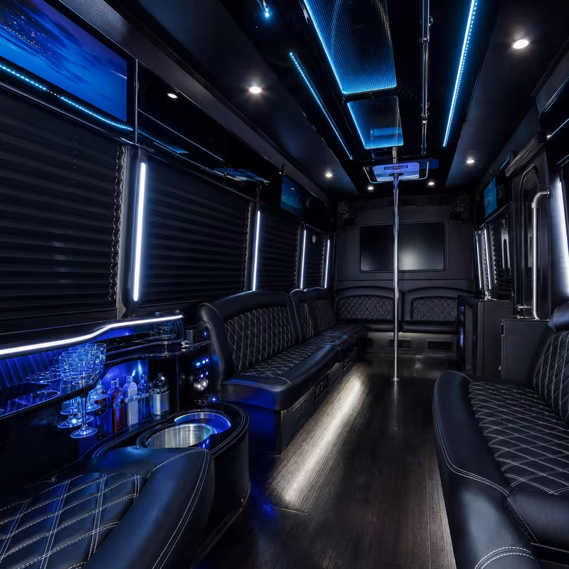 Party bus interior with wraparound leather seating and LED lighting in Charlotte