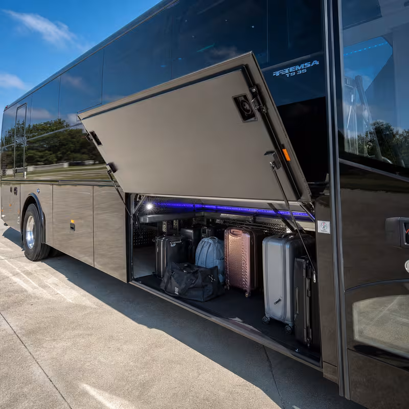 Party bus interior with wraparound leather seating and LED lighting in Charlotte